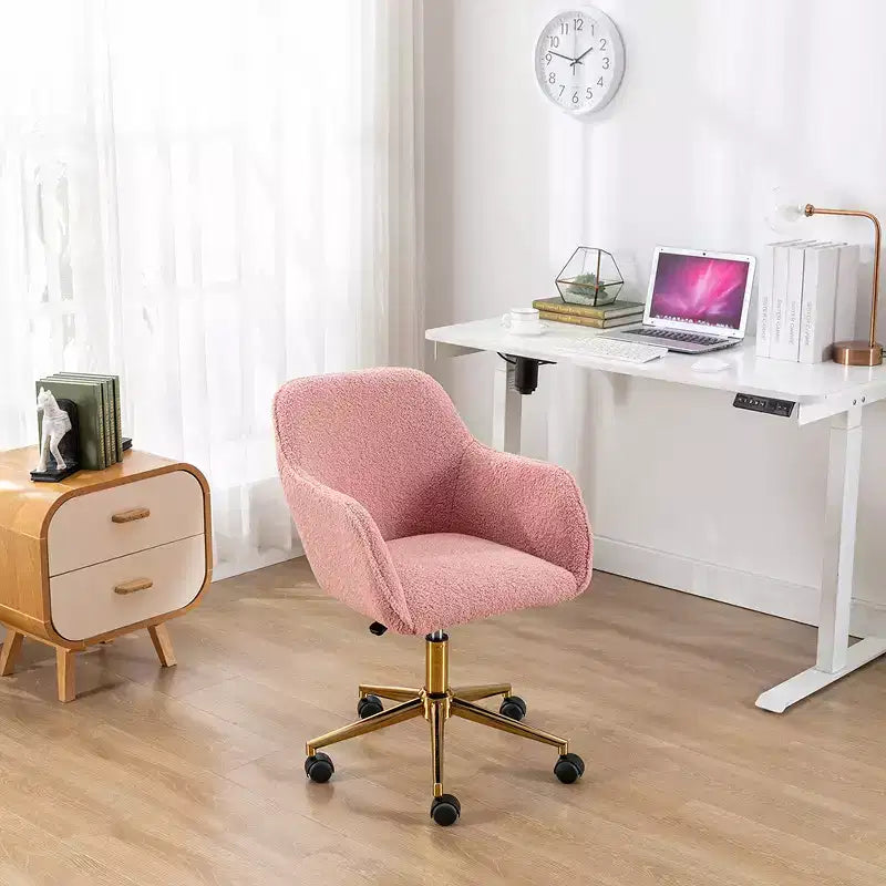 This swivel office chair is height-adjustable, has wheels, gold-plated legs, and a chrome-plated base.