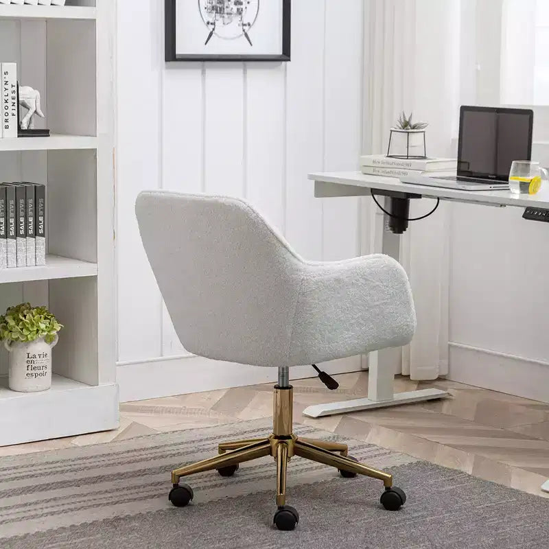 This swivel office chair is height-adjustable, has wheels, gold-plated legs, and a chrome-plated base.
