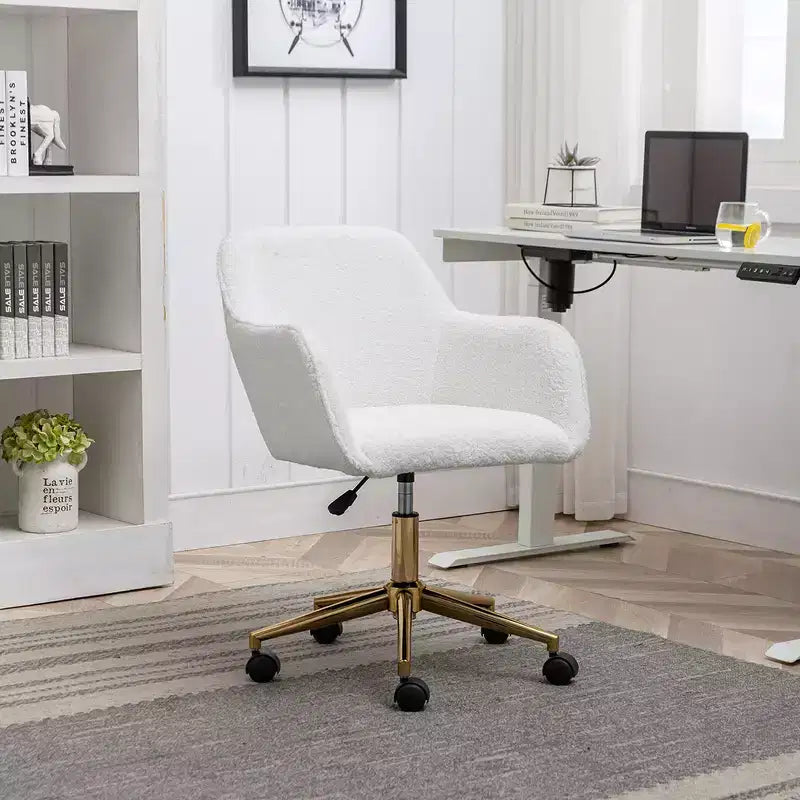 This swivel office chair is height-adjustable, has wheels, gold-plated legs, and a chrome-plated base.