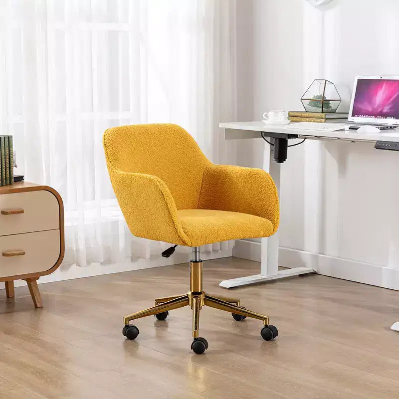 This swivel office chair is height-adjustable, has wheels, gold-plated legs, and a chrome-plated base.