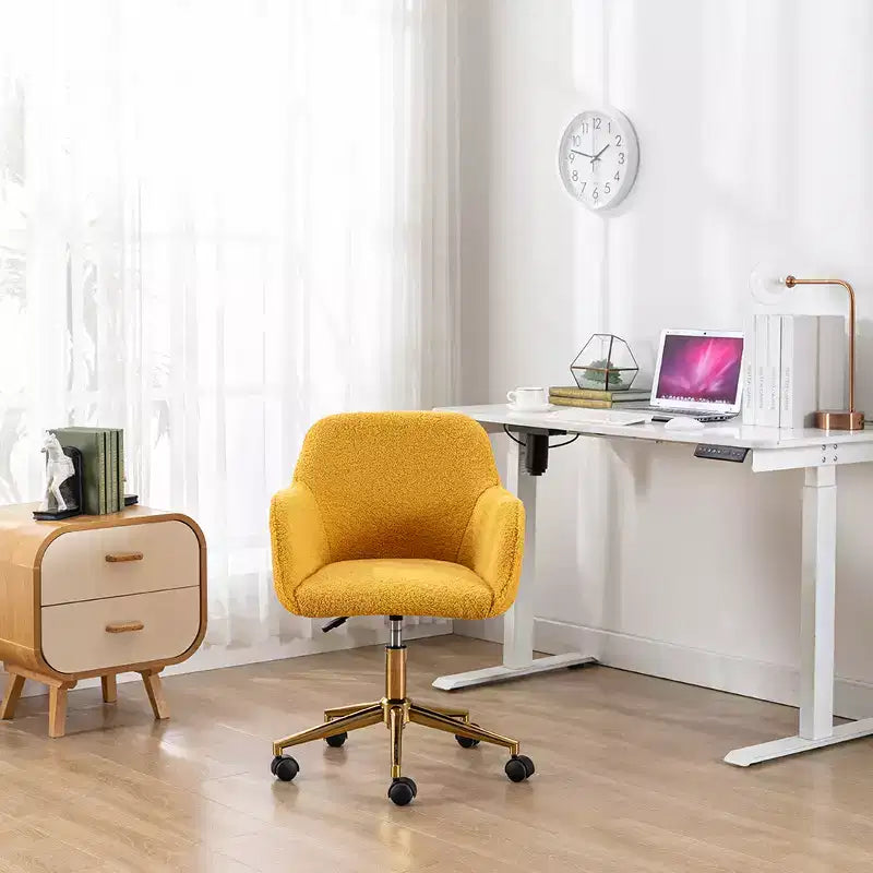 This swivel office chair is height-adjustable, has wheels, gold-plated legs, and a chrome-plated base.