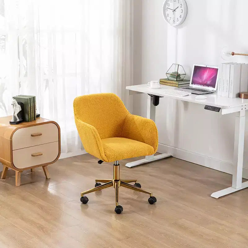 This swivel office chair is height-adjustable, has wheels, gold-plated legs, and a chrome-plated base.