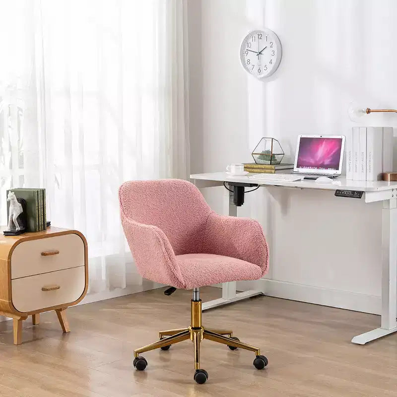 This swivel office chair is height-adjustable, has wheels, gold-plated legs, and a chrome-plated base.