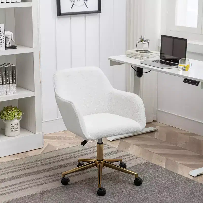 This swivel office chair is height-adjustable, has wheels, gold-plated legs, and a chrome-plated base.