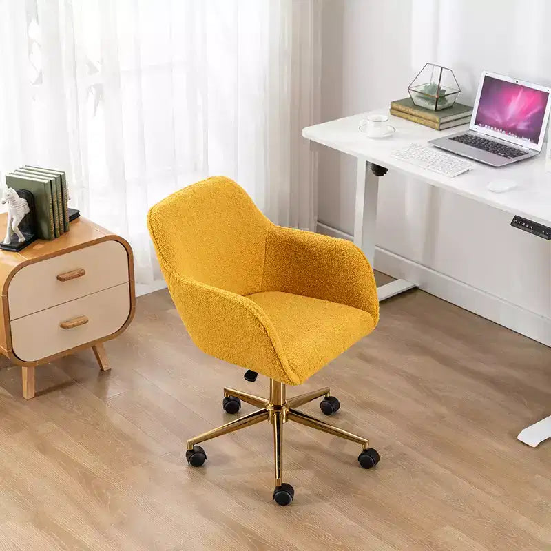 This swivel office chair is height-adjustable, has wheels, gold-plated legs, and a chrome-plated base.